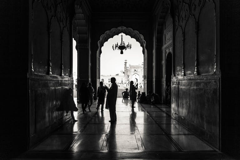 Monochrome Photography of People Inside Building