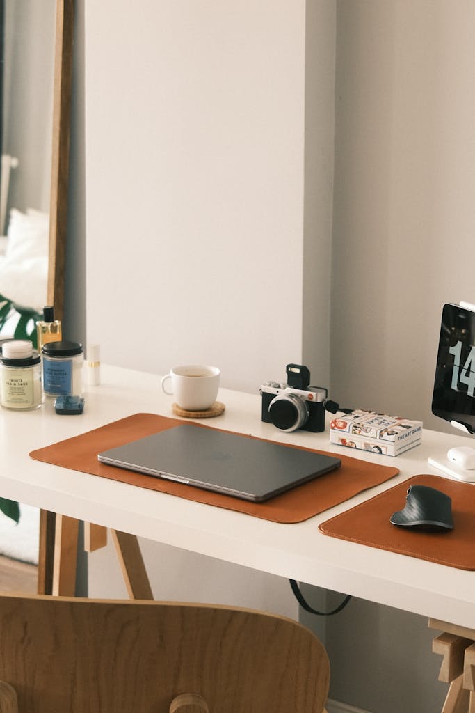 Laptop and Camera on Desk